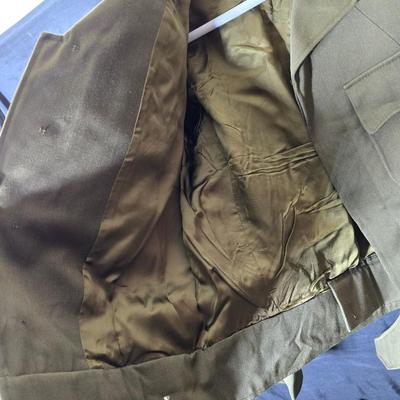 a collection of U.S. Army WWII-era wool Eisenhower, or "Ike", jacket and field shirt