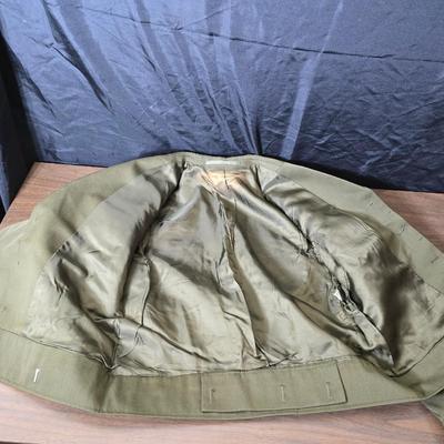 a collection of U.S. Army WWII-era wool Eisenhower, or "Ike", jacket and field shirt