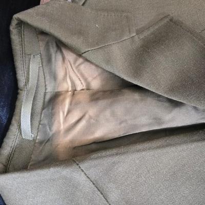 a collection of U.S. Army WWII-era wool Eisenhower, or "Ike", jacket and field shirt