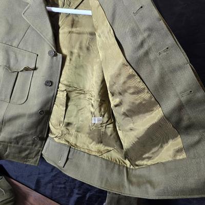 a collection of U.S. Army WWII-era wool Eisenhower, or "Ike", jacket and field shirt