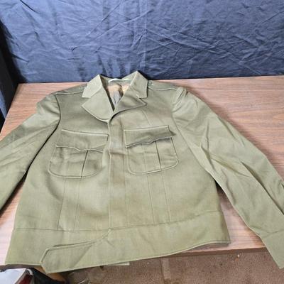 a collection of U.S. Army WWII-era wool Eisenhower, or "Ike", jacket and field shirt