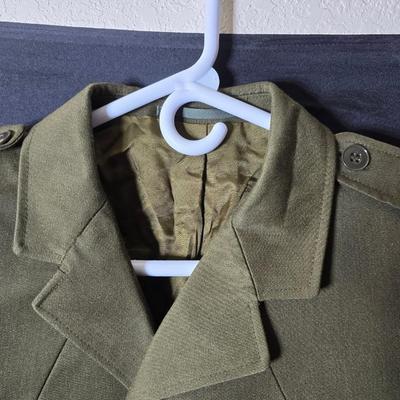 a collection of U.S. Army WWII-era wool Eisenhower, or "Ike", jacket and field shirt