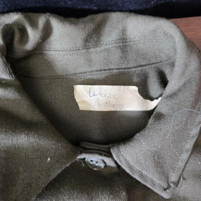 a collection of U.S. Army WWII-era wool Eisenhower, or "Ike", jacket and field shirt