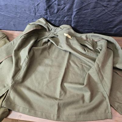 a collection of U.S. Army WWII-era wool Eisenhower, or "Ike", jacket and field shirt