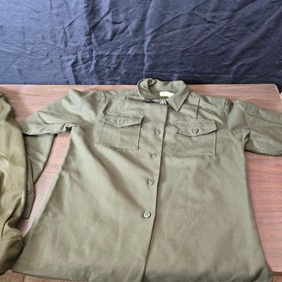 a collection of U.S. Army WWII-era wool Eisenhower, or "Ike", jacket and field shirt