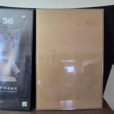 Two 24" x 36" poster frames