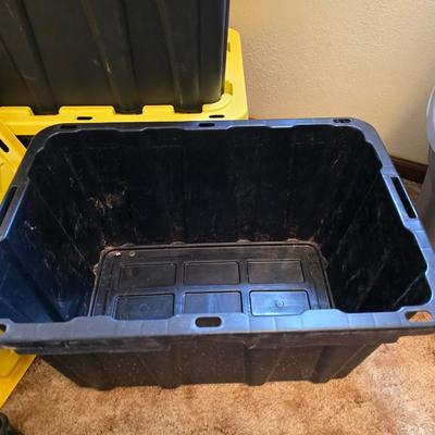 Four HDX Storage totes with yellow lids - 27 gallon