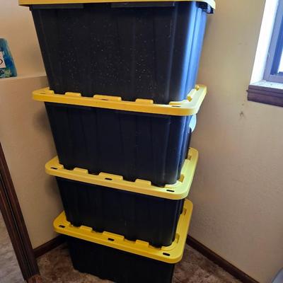 Four HDX Storage totes with yellow lids - 27 gallon