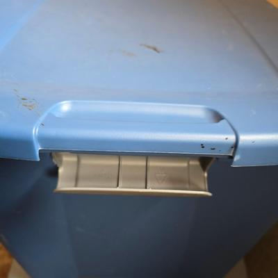 Four storage totes with lids - various sizes