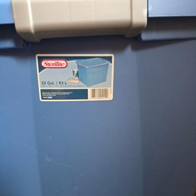 Four storage totes with lids - various sizes