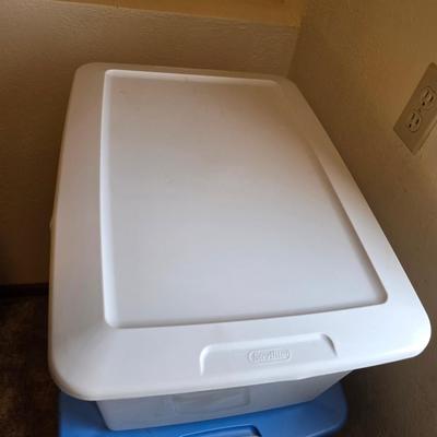 Four storage totes with lids - various sizes