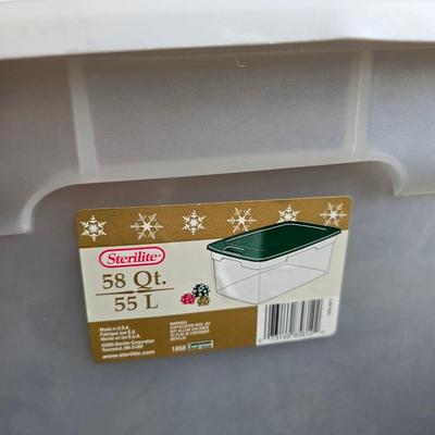 Four storage totes with lids - various sizes