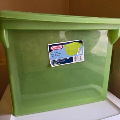 Four storage totes with lids - various sizes