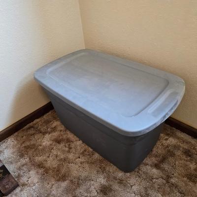 Four storage totes with lids - various sizes