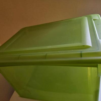Four storage totes with lids - various sizes