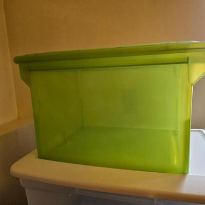 Four storage totes with lids - various sizes