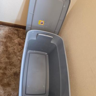 Four storage totes with lids - various sizes