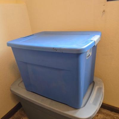 Four storage totes with lids - various sizes
