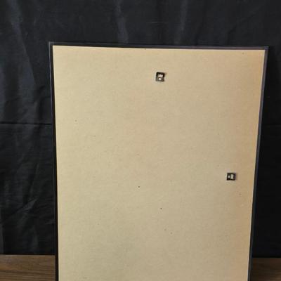 Two framed cross stitch wall art with a collection of pretty doilies