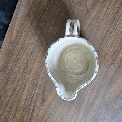 Framed artwork with a collection of pottery - and a fossil stone platter