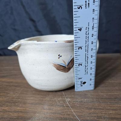 Framed artwork with a collection of pottery - and a fossil stone platter