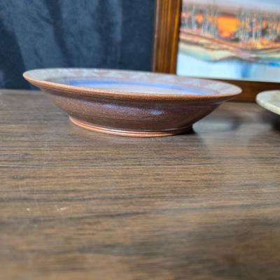 Framed artwork with a collection of pottery - and a fossil stone platter