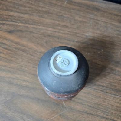 Framed artwork with a collection of pottery - and a fossil stone platter