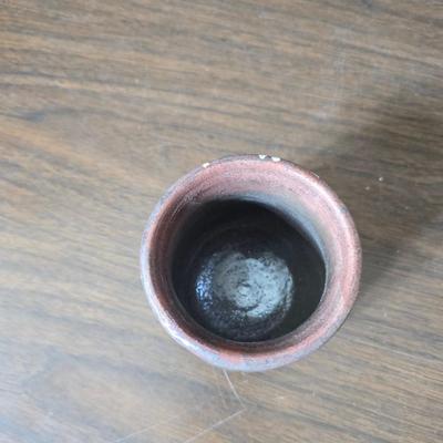 Framed artwork with a collection of pottery - and a fossil stone platter