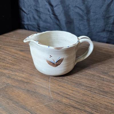 Framed artwork with a collection of pottery - and a fossil stone platter