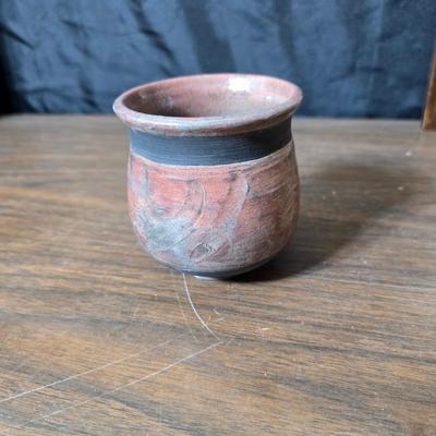 Framed artwork with a collection of pottery - and a fossil stone platter