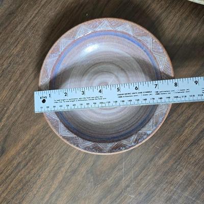 Framed artwork with a collection of pottery - and a fossil stone platter