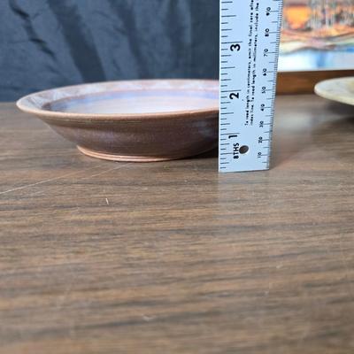 Framed artwork with a collection of pottery - and a fossil stone platter