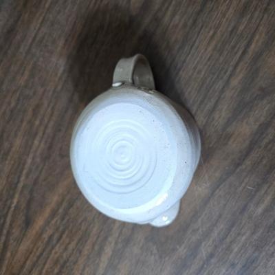 Framed artwork with a collection of pottery - and a fossil stone platter