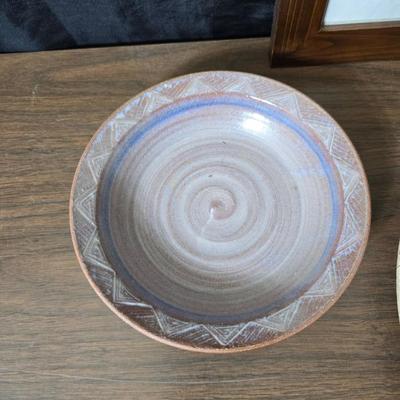 Framed artwork with a collection of pottery - and a fossil stone platter