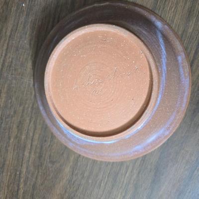 Framed artwork with a collection of pottery - and a fossil stone platter