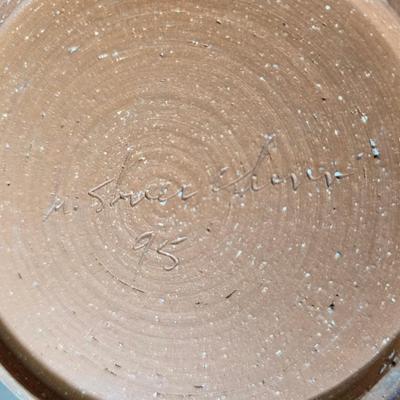 Framed artwork with a collection of pottery - and a fossil stone platter