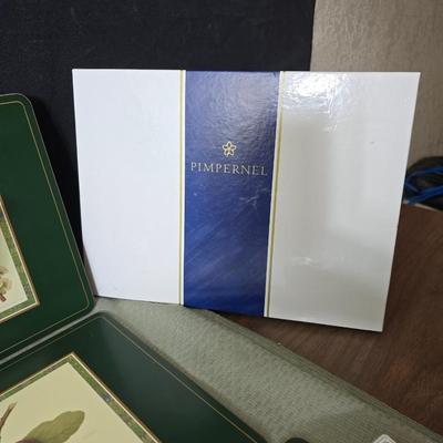 Hooker's Fruits Pimpernel cork backed placemats and matching coasters - Brass candle sticks- a tablecloth and a pottery hotplate