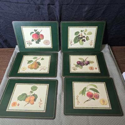 Hooker's Fruits Pimpernel cork backed placemats and matching coasters - Brass candle sticks- a tablecloth and a pottery hotplate