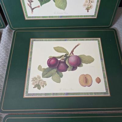 Hooker's Fruits Pimpernel cork backed placemats and matching coasters - Brass candle sticks- a tablecloth and a pottery hotplate