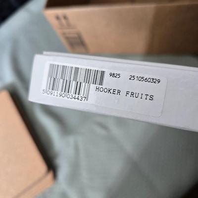 Hooker's Fruits Pimpernel cork backed placemats and matching coasters - Brass candle sticks- a tablecloth and a pottery hotplate