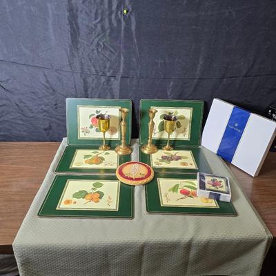 Hooker's Fruits Pimpernel cork backed placemats and matching coasters - Brass candle sticks- a tablecloth and a pottery hotplate