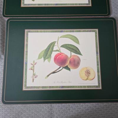 Hooker's Fruits Pimpernel cork backed placemats and matching coasters - Brass candle sticks- a tablecloth and a pottery hotplate