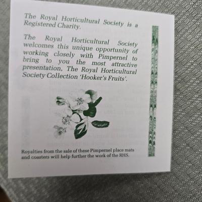 Hooker's Fruits Pimpernel cork backed placemats and matching coasters - Brass candle sticks- a tablecloth and a pottery hotplate