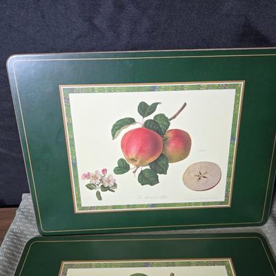 Hooker's Fruits Pimpernel cork backed placemats and matching coasters - Brass candle sticks- a tablecloth and a pottery hotplate