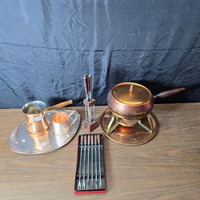 Copper fondu pot with forks a "Le Saucier" copper sauce pot with copper toned tray and mug