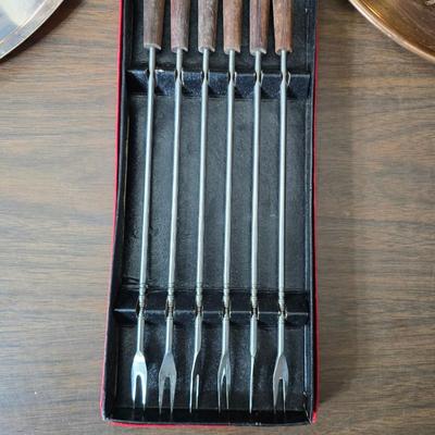 Copper fondu pot with forks a "Le Saucier" copper sauce pot with copper toned tray and mug