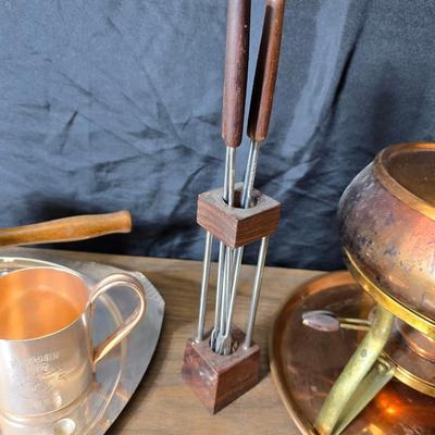 Copper fondu pot with forks a "Le Saucier" copper sauce pot with copper toned tray and mug