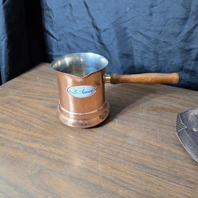 Copper fondu pot with forks a "Le Saucier" copper sauce pot with copper toned tray and mug