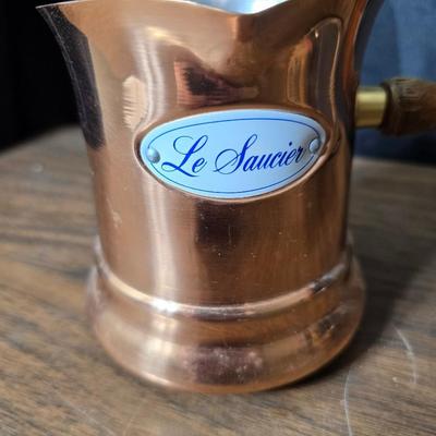 Copper fondu pot with forks a "Le Saucier" copper sauce pot with copper toned tray and mug