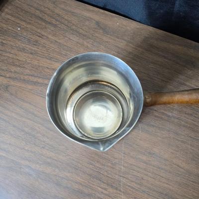 Copper fondu pot with forks a "Le Saucier" copper sauce pot with copper toned tray and mug